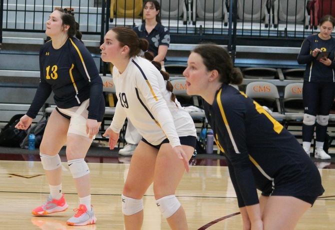 Chloie Garber (left), Ezmeralda Albright (center), and Elizabeth Brown (right) each recorded a game-high nine digs in the Trailblazers' first game against Chapman University.